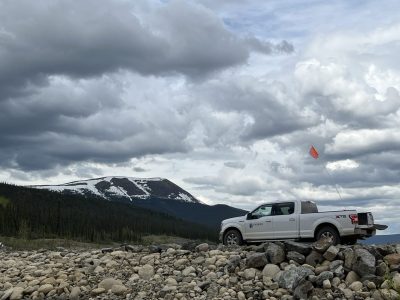 ensero truck on rocky road with mountains in distance