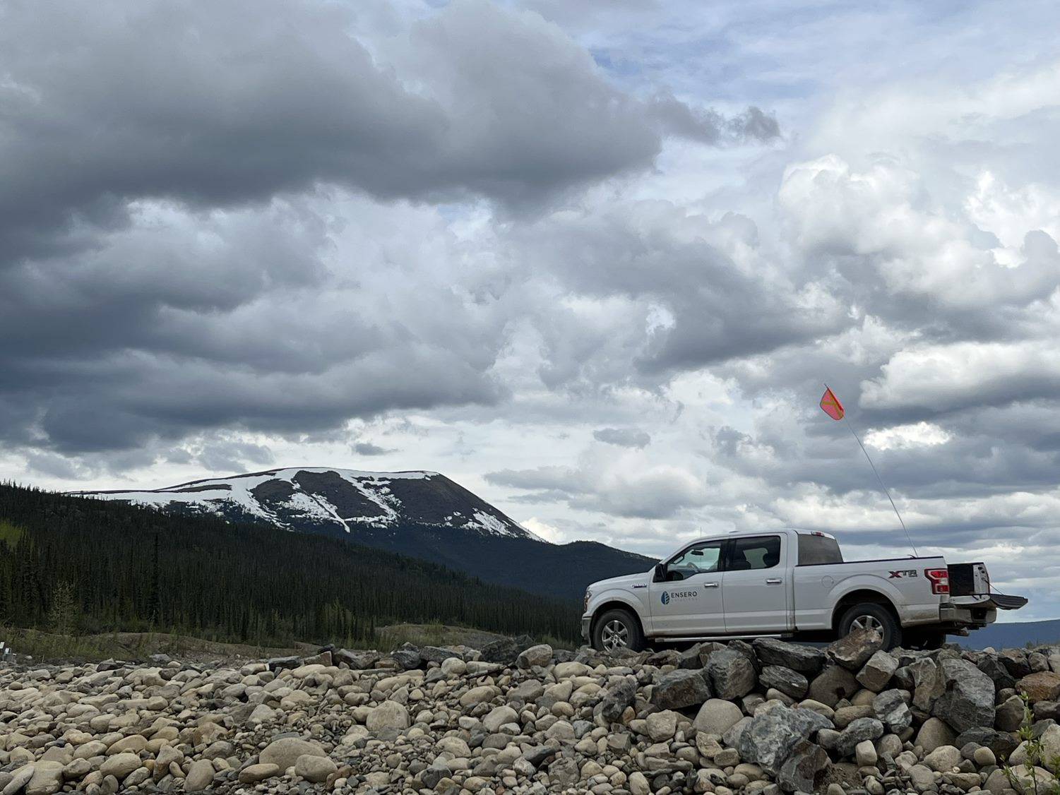 ensero truck on rocky road with mountains in distance