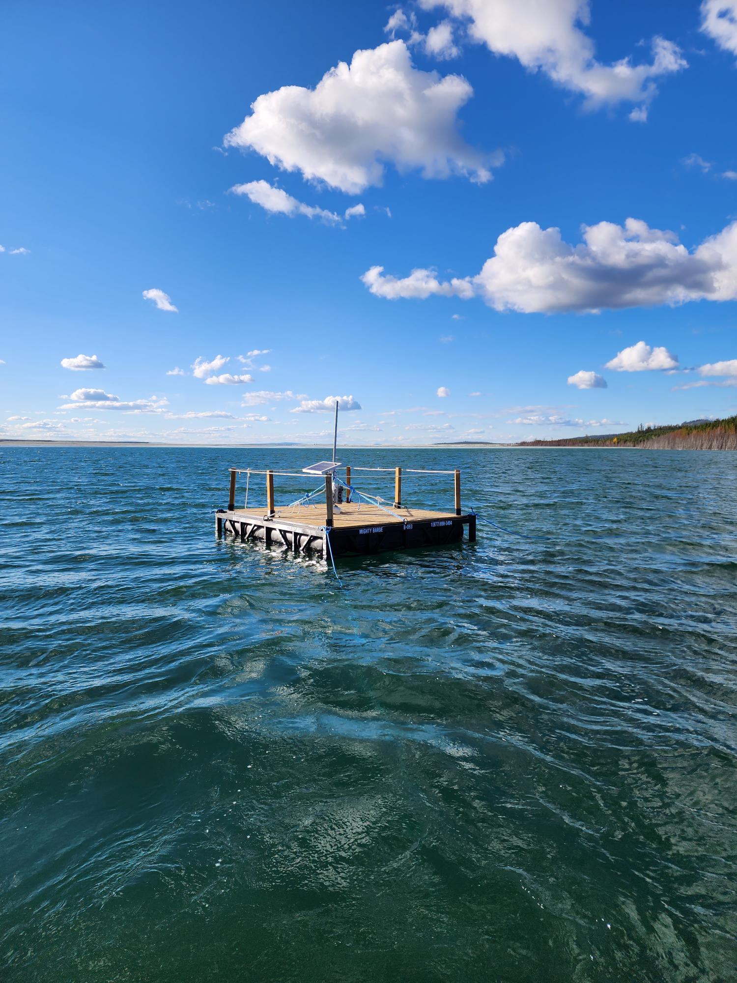 raft with solar panel floating in large body of water