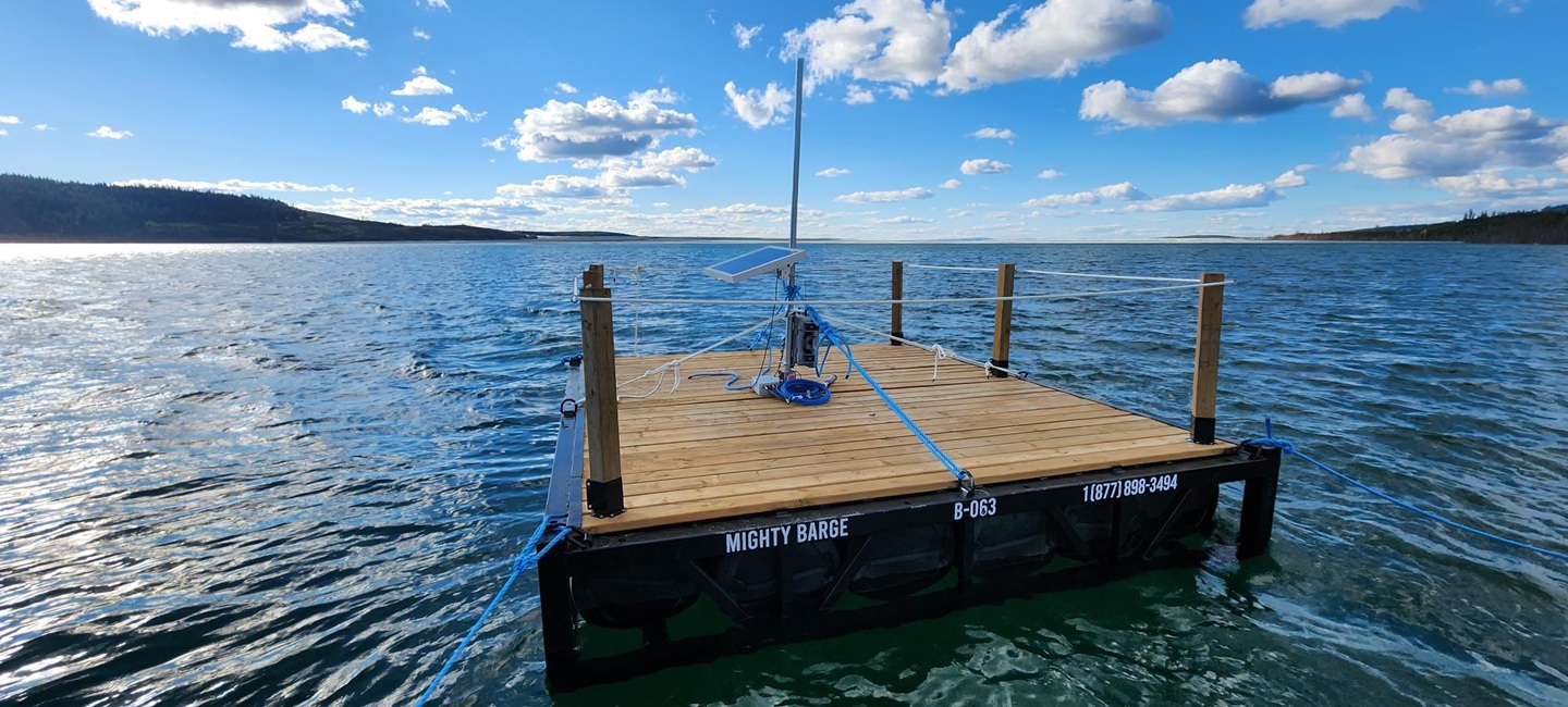 floating barge with solar panel on it in water