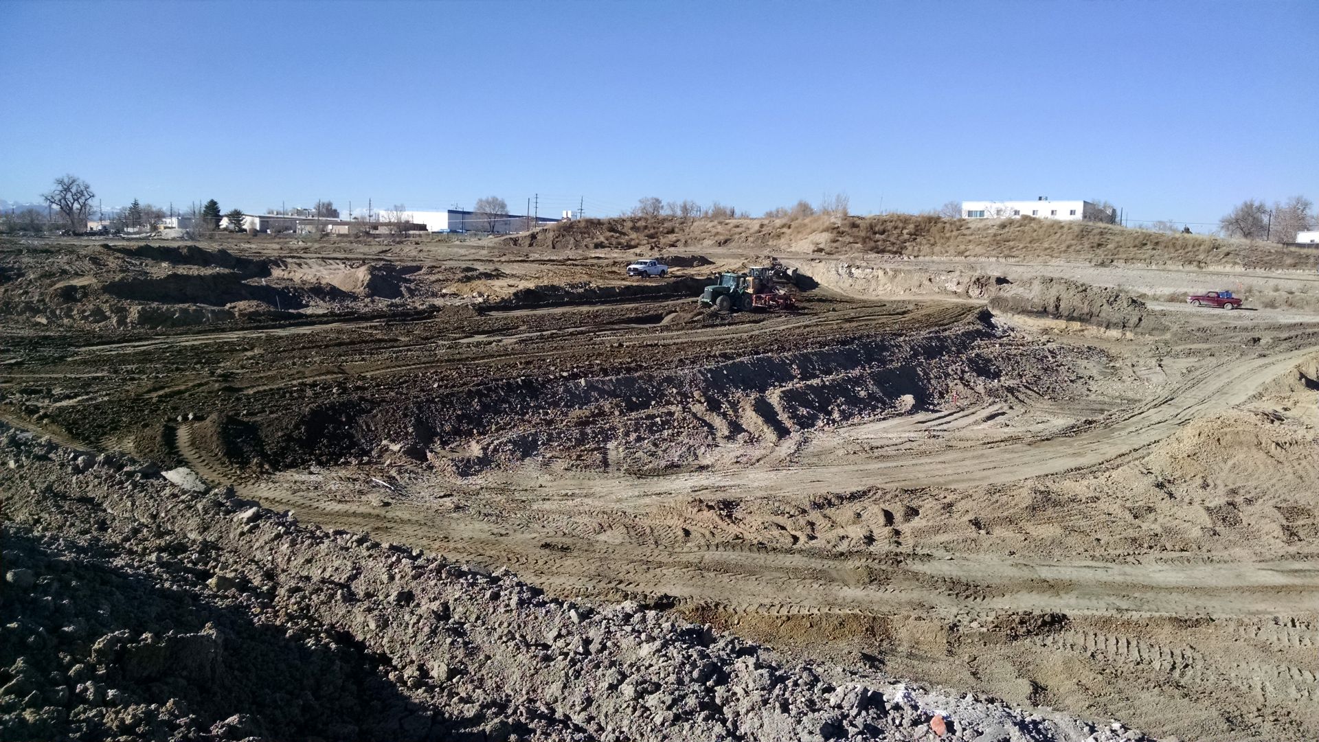 view of mine in colorado with dirt hills and equipment