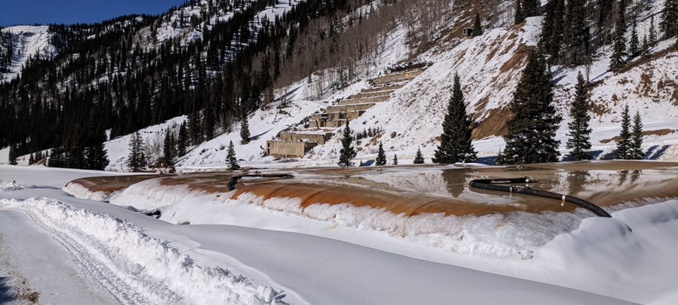 snowy project site with trees in mountain