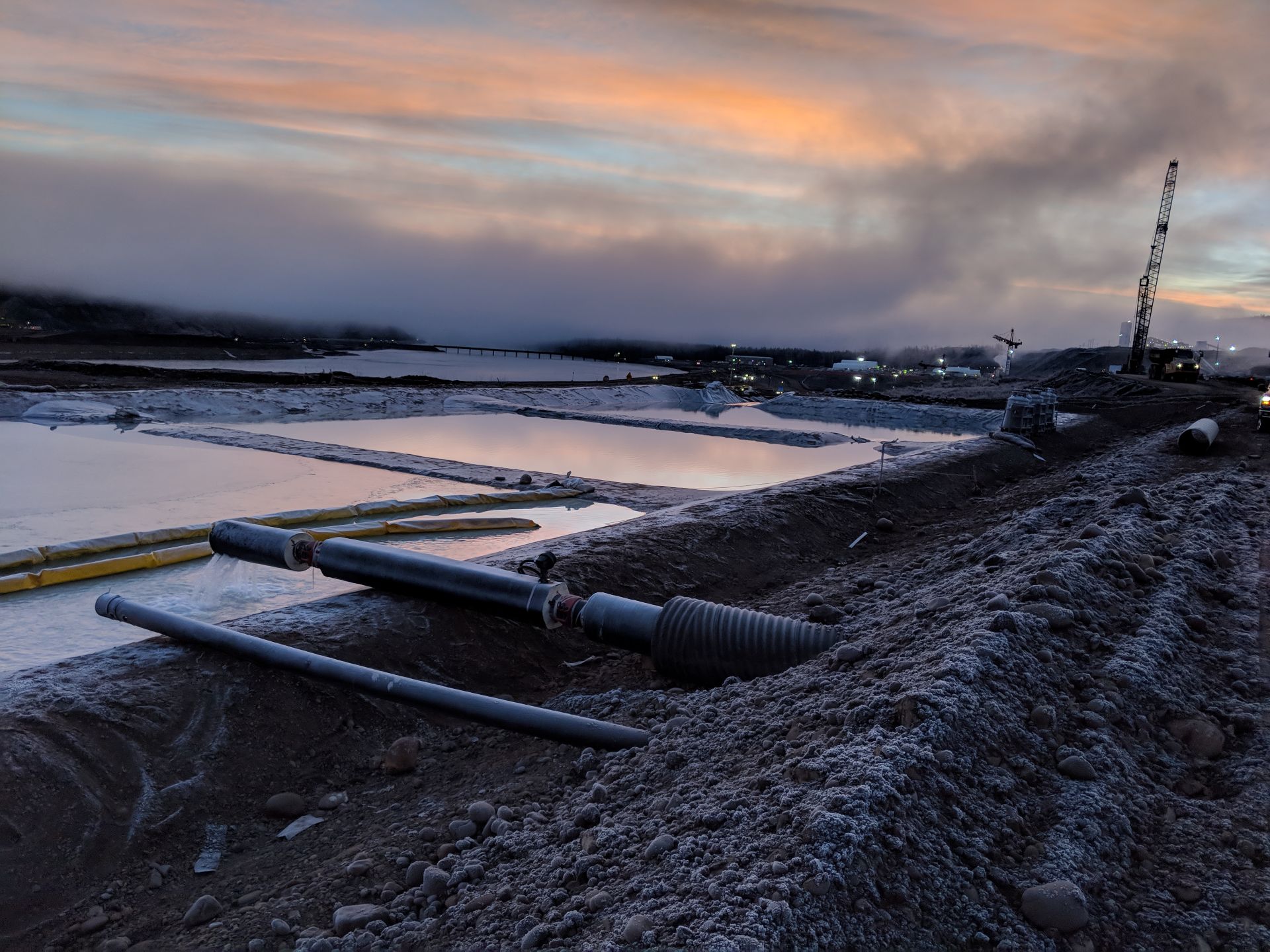 water areas with pipes and equipment at sunrise