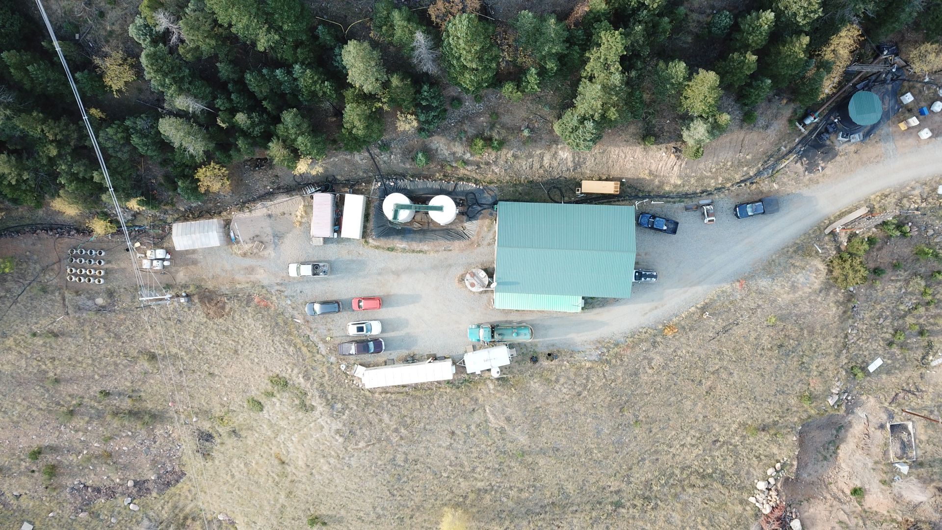 aerial view of mine with view of buildings and vehicles