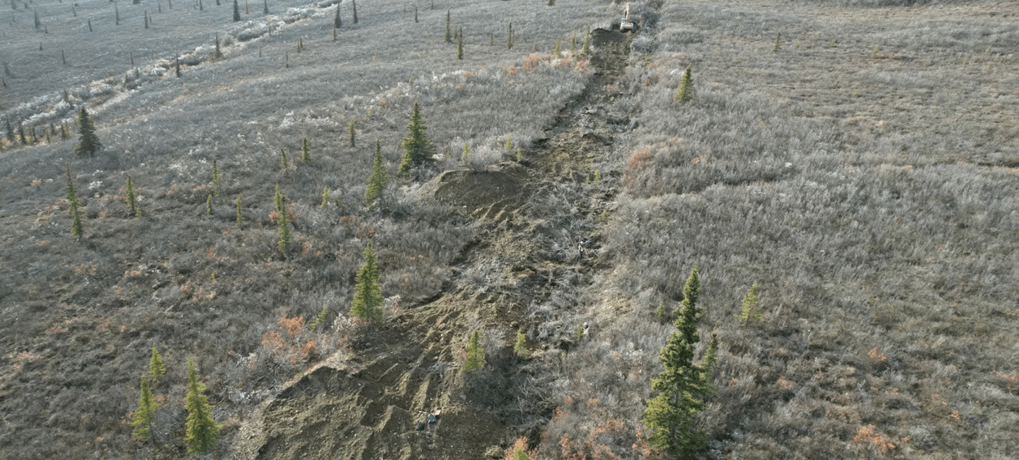 aerial view of try arid mountain area with dirt path