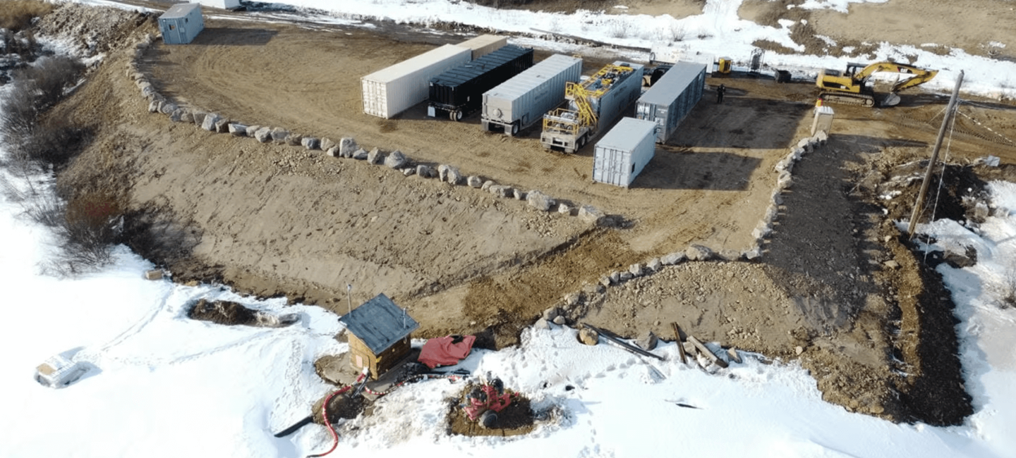 aerial view of project area and vehicles in snowy area