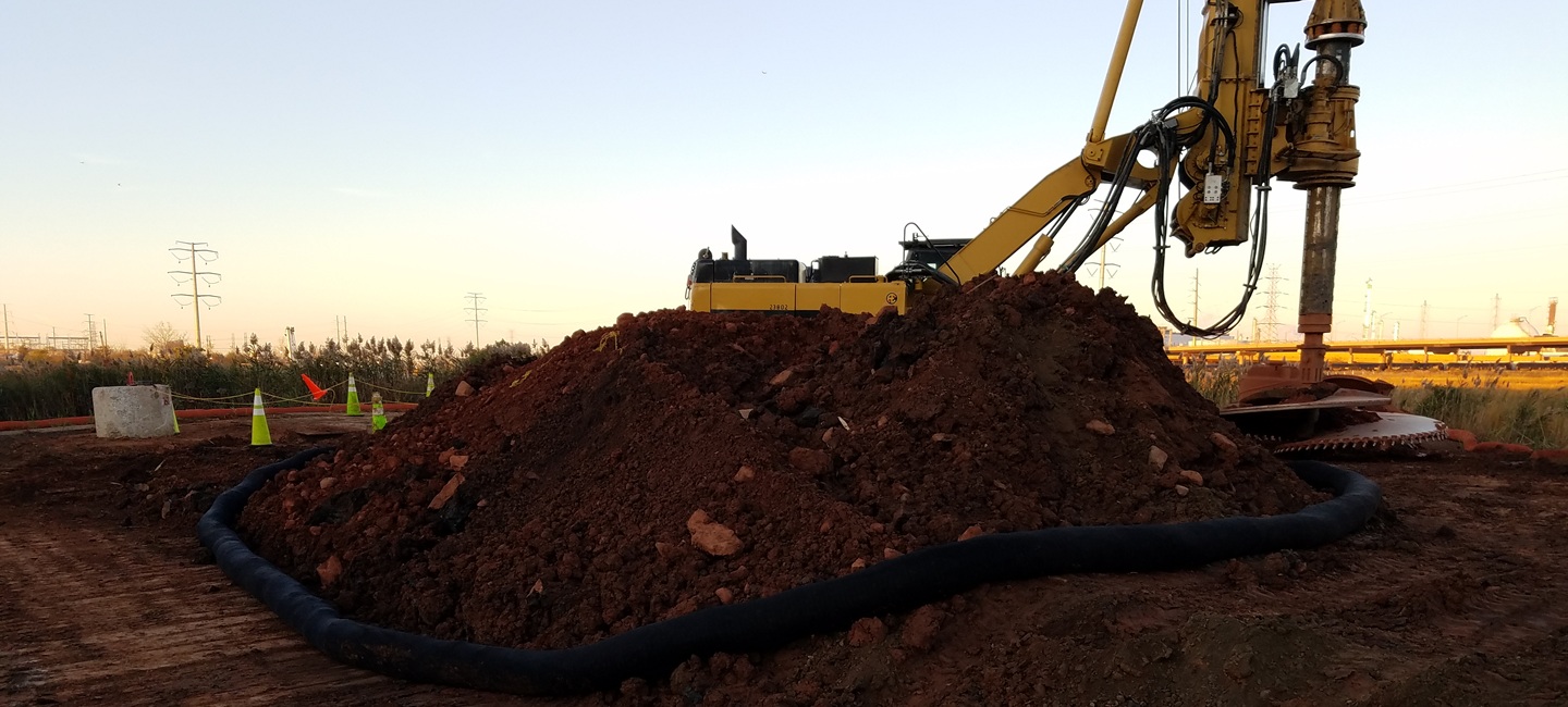 dirt mound with construction equipment