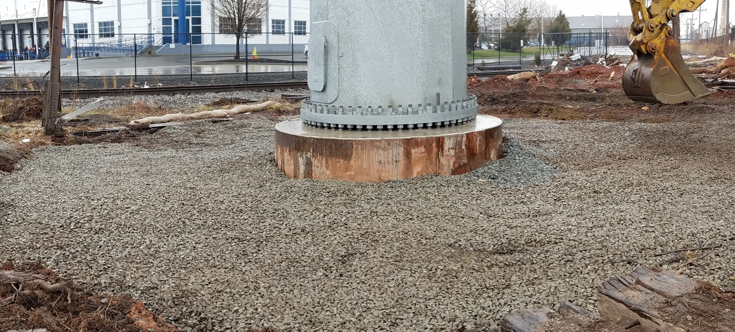 close up of gravel with power line foundation area