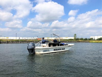 people on a research boat in a body of water