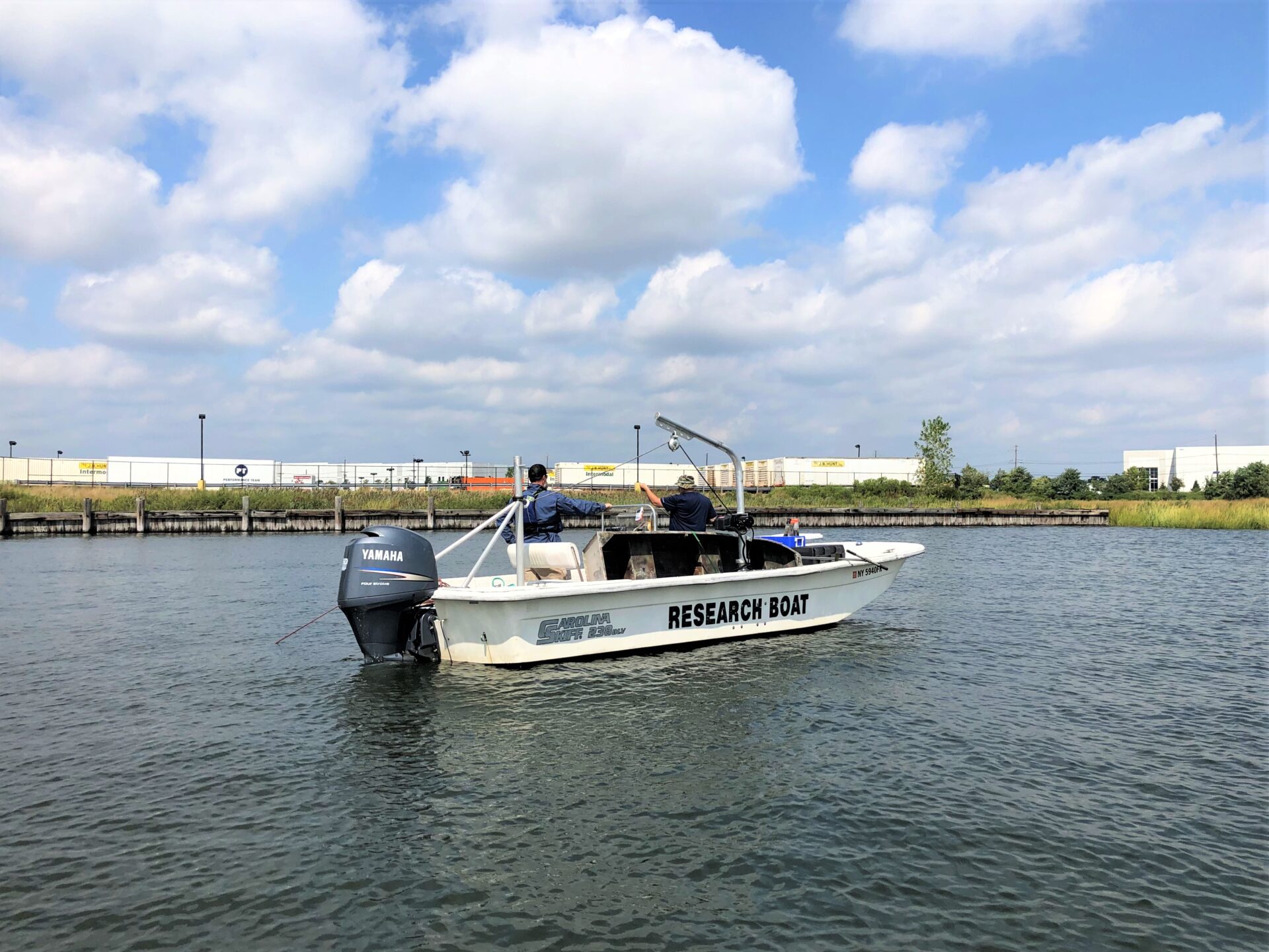people on a research boat in a body of water