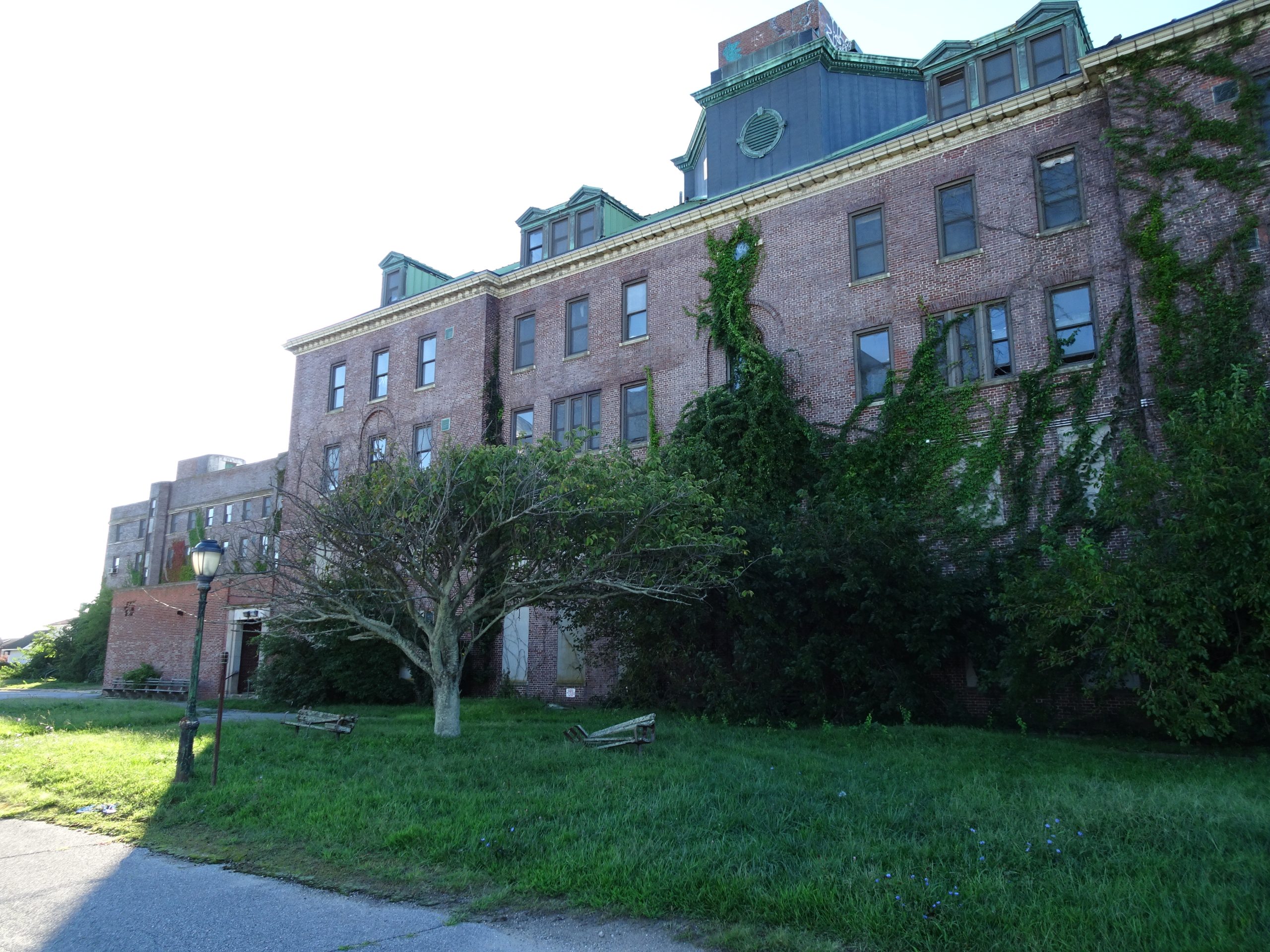 old brick building with trees