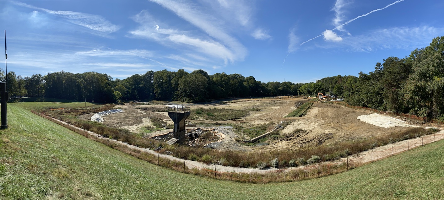 dam as its being worked on large dirt area with equipment