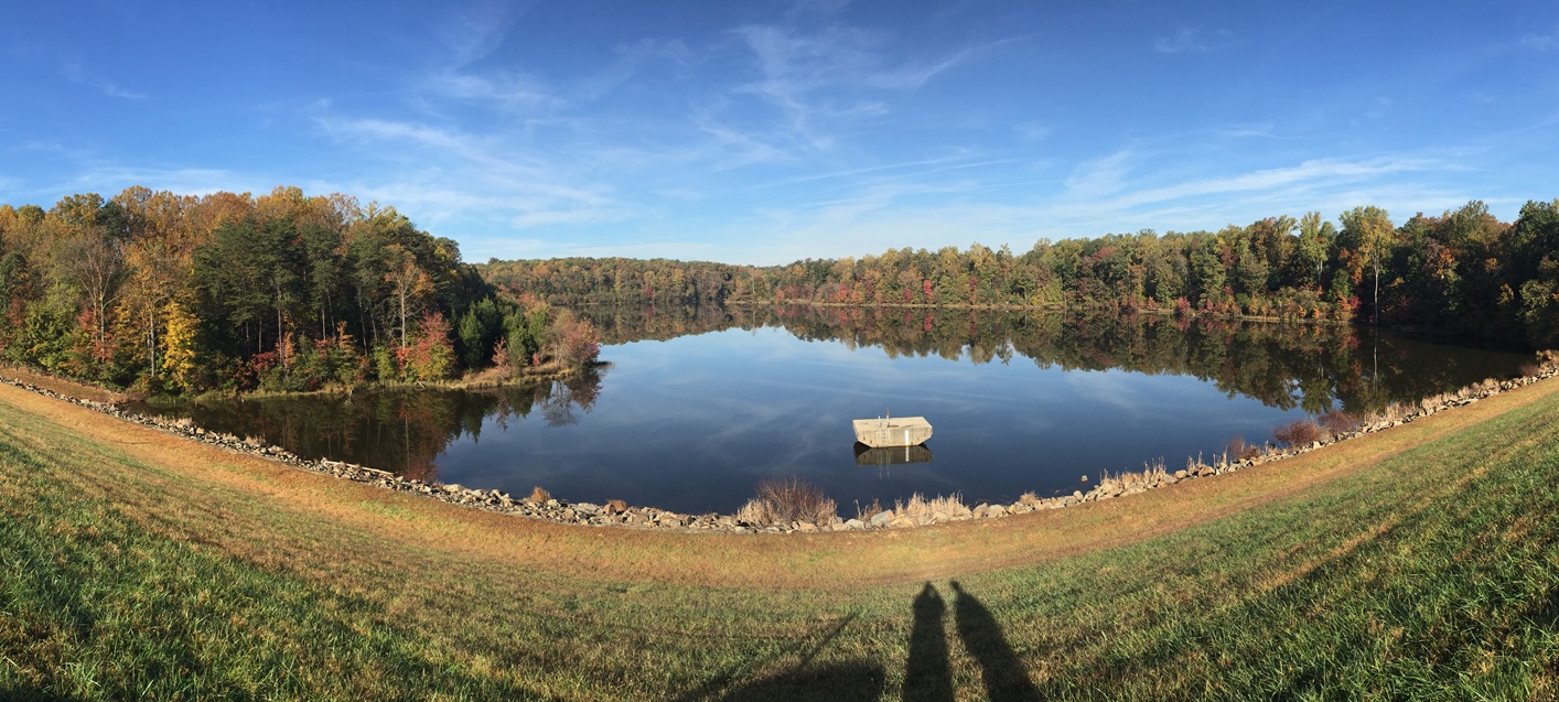 panoramic view of dam with concrete platform in water
