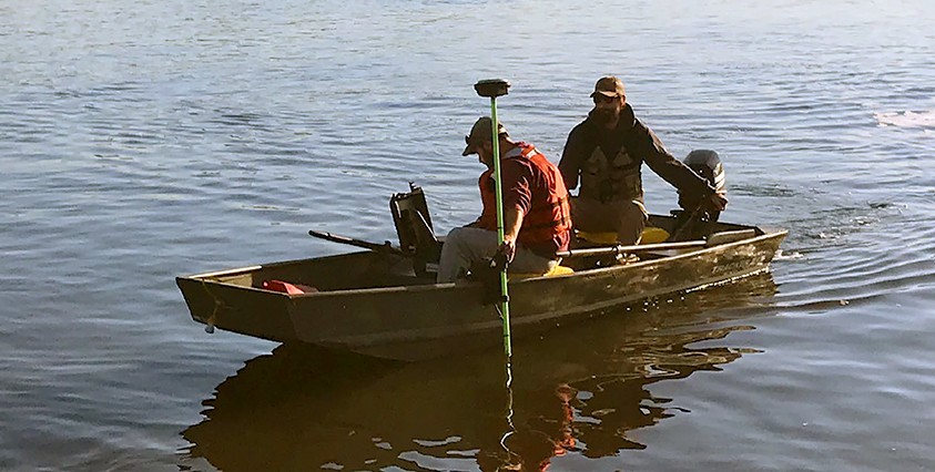 two surveyors in boat