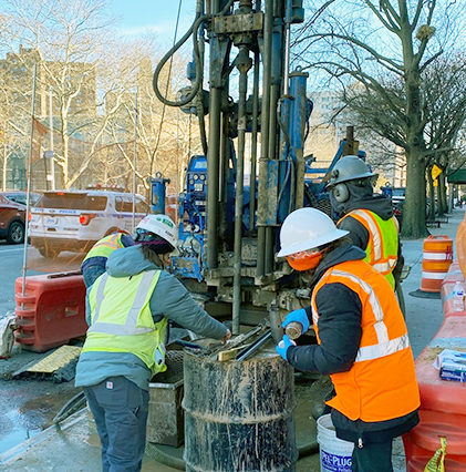 team members with large equipment