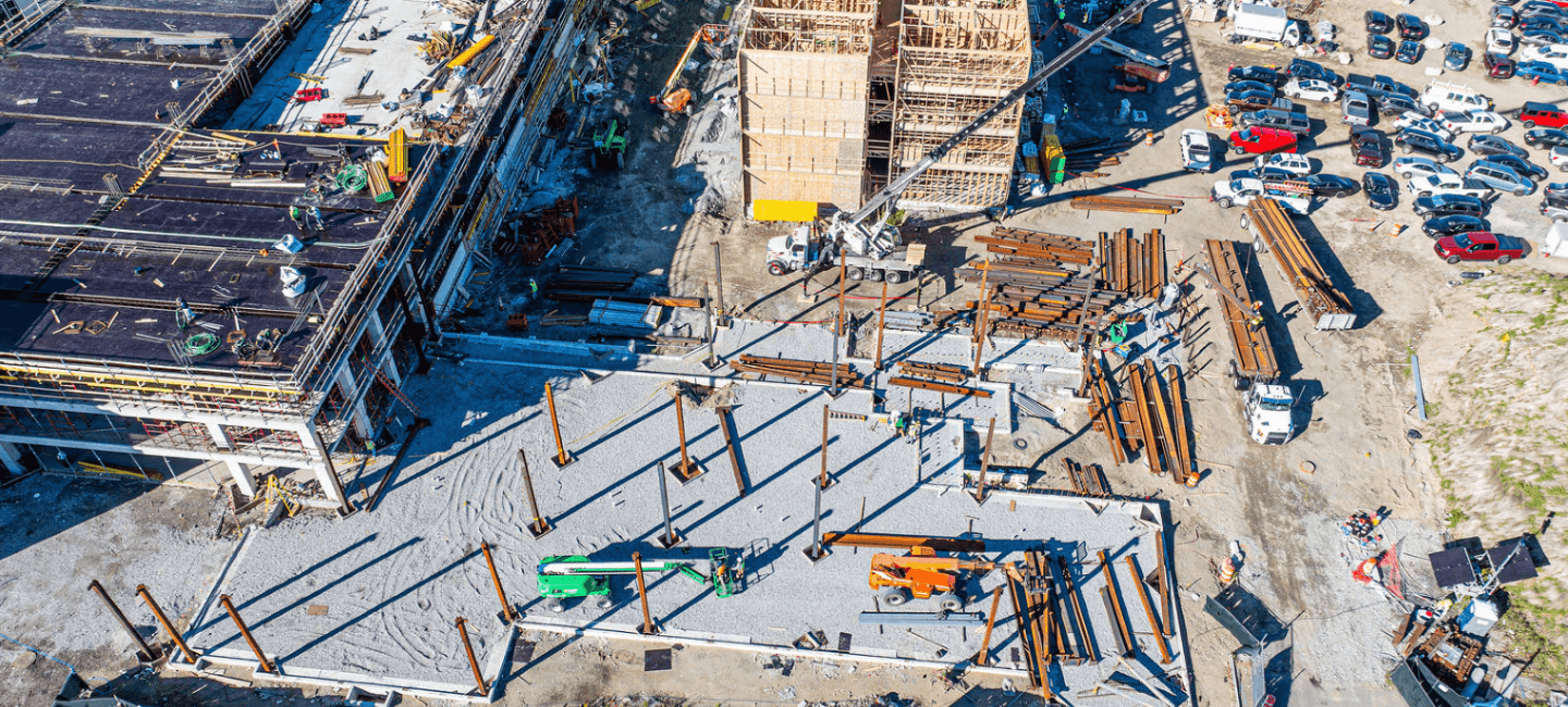 aerial view of construction area with beam and large equipment