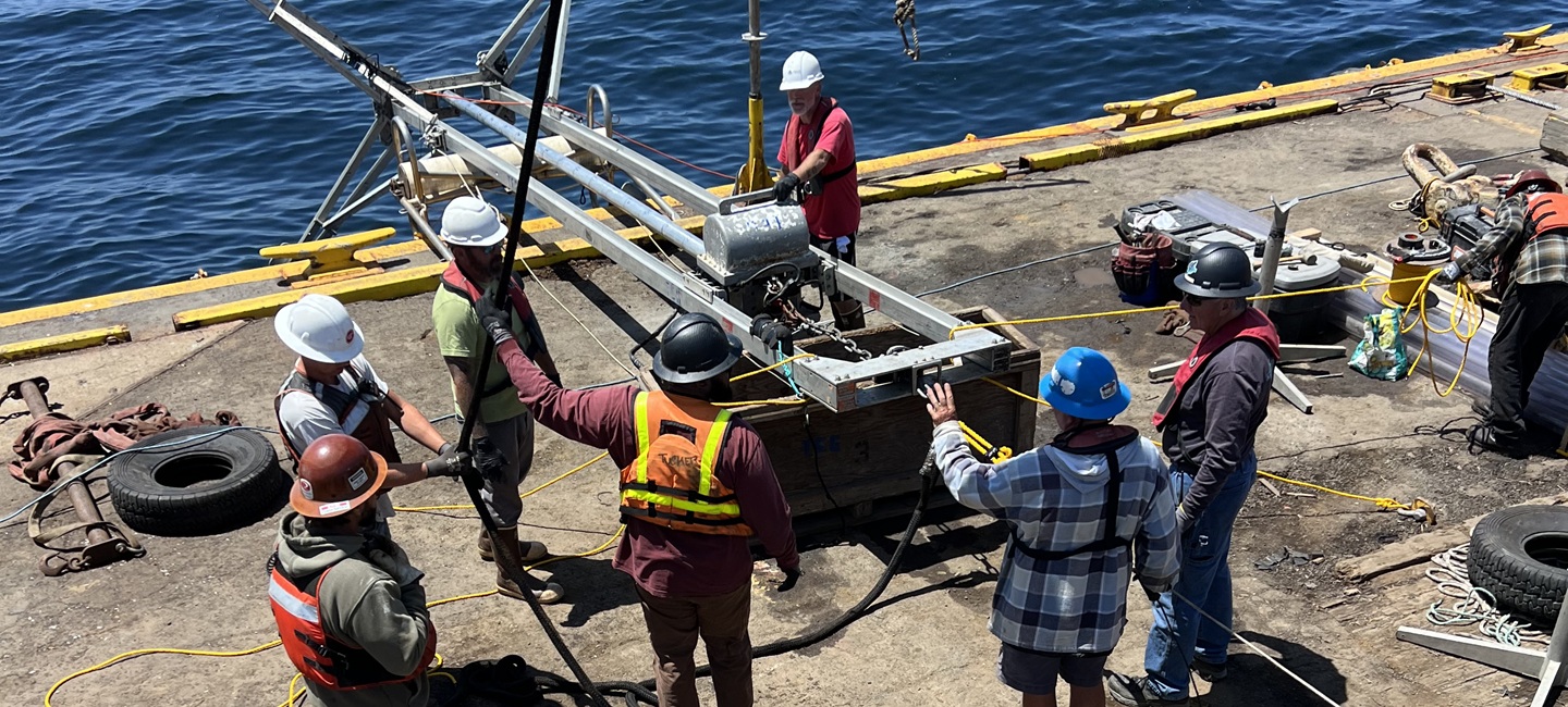 team members around infrastructure on deck